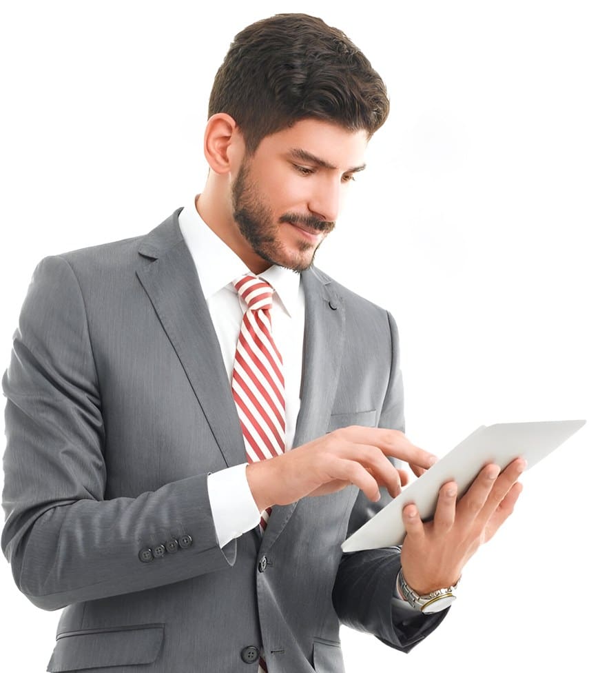 A man in a suit and tie using a tablet.